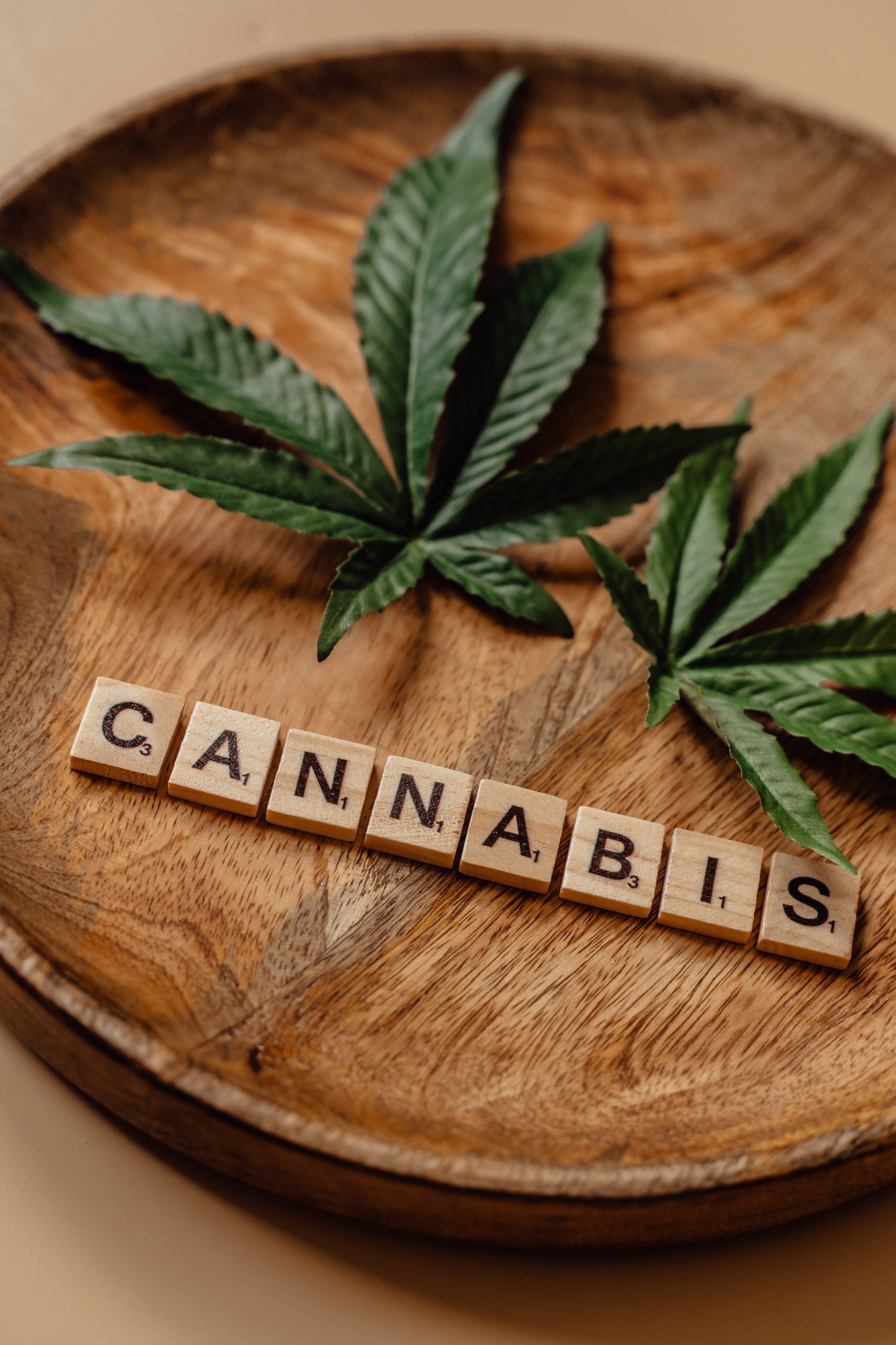 Cannabis leaves with cannabis spelled out in scrabble letters