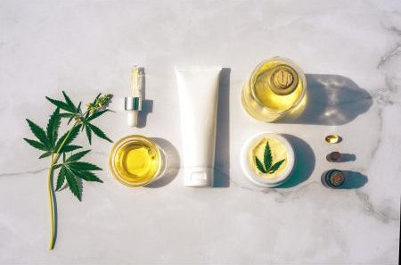 Marijauna leaf, serum bottles, and lotion bottles.